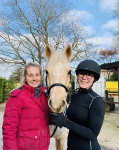 Elizabeth and Amelia with Popcorn the palamino horse