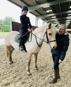 Popcorn in the indoor horse riding arena at Lavant Equestrian