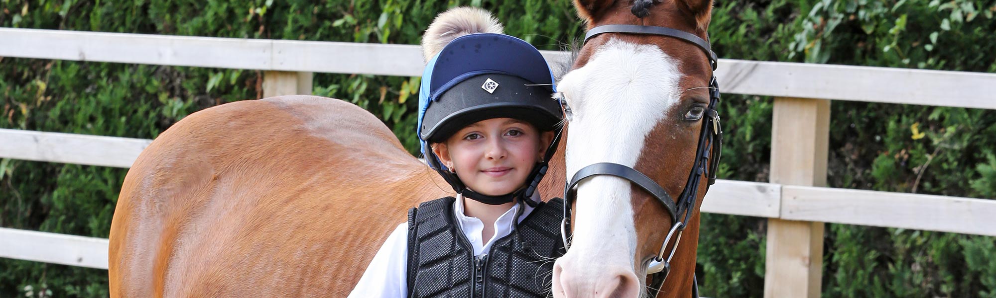 Child with pony at Lavant Equestrian